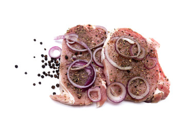 Marinated meat, with onions and spices, isolated on white background.