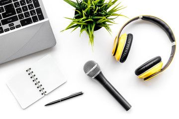blogger, journalist office with laptop, notebook, microphone and headphones white background top...