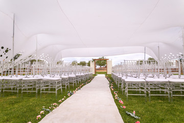Outside wedding venue with white wedding tent