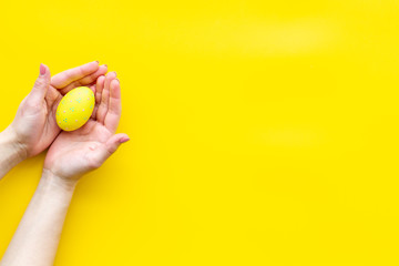 paint eggs for Easter celebration on yellow background top view mock up