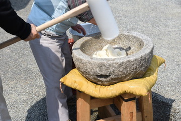 How to make Japanese traditional rice cakes (Mochi-tuki) is many times pounding with a mallet with...