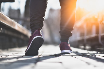 Close up of man sneakers on street