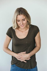 Young woman having a stomach ache