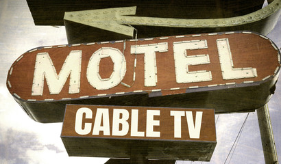 Fototapeta premium aged and worn vintage neon motel sign