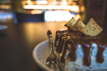 A piece of cake, covered with chocolate close-up