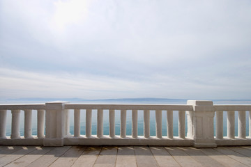 Promenade path near the mediterranean sea, concrete fence - off season