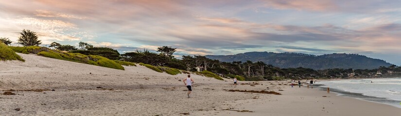 Panorama of a Jogger on the beach at Carmel Cove