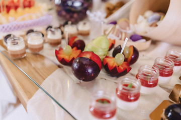 sweet festive buffet, fruit, caps, macaroni and lots of sweets