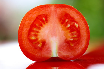 Close up of fresh picked tomato photographed in daylight conditions