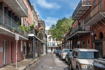 Naklejka na ściany i meble A Narrow Lane in the French Quarter, Wrought Iron Balconies, New Orleans, Louisiana, USA