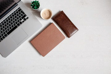 White office desk table with computer keyboard and other office supplies. Top view with copy space, flat lay