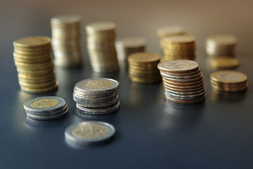 Closeup of silver and copper coins of all states on a dark background