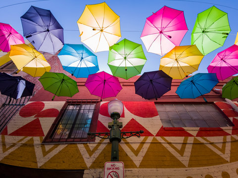 Colorful umbrellas hanging in the famous Orange Street Alley