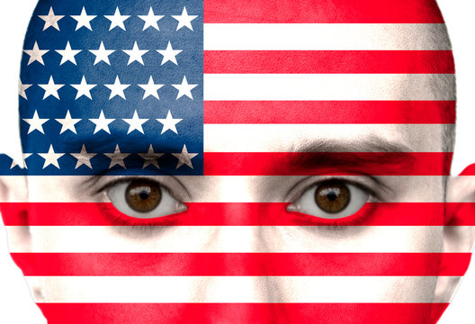 National flag, america colored depicted in paint on a man's face close-up, isolated on a white background