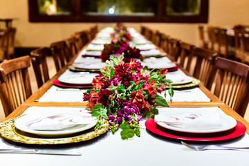 table setting with flowers, table setting, social event, christmas table, elegant dinner table setting, festive long table decor, celebratory dining arrangement, restaurant event setup