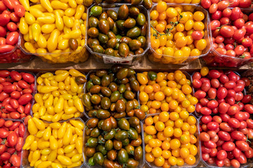 Rows of Grape Tomatoes & Cherry Tomatoes at a farmer's Market