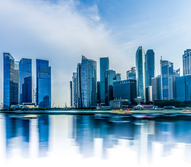 Fototapeta na wymiar Singapore cityscape with water reflection at Marina bay