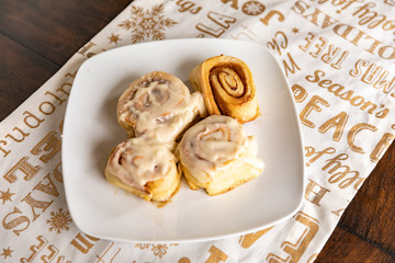 Home made cinnamon Rolls on a Gold Christmas Table Cloth