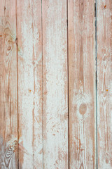 Obraz premium The texture of the old shabby fence of painted white paint boards