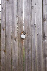 Door Lock on the old gray gate