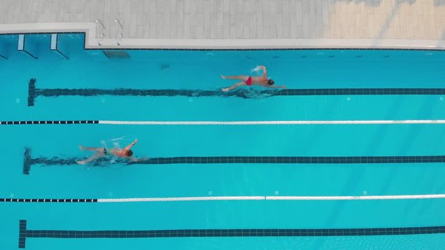 pool by drone men swimming summer outdoor
