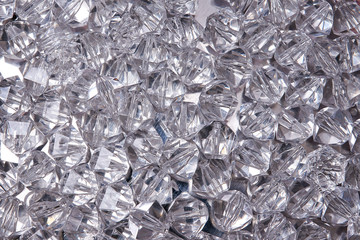 Texture of crystal rhinestones. Small stones of glass. Bijouterie. Artificial jewelry made of glass and plastic. Rhinestones For background