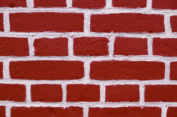 Obraz premium wall of red bricks with white paint texture, background. exterior