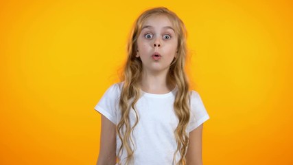 Funny girl with big eyes extremely surprised, unexpected sales and discounts