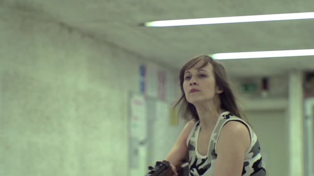 Slow Motion - Young Girl Aiming Thomson