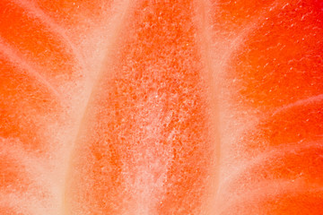The structure of the cut strawberries close-up. Macro cut of strawberries.