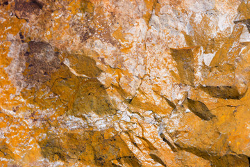 Rock texture and surface background. Cracked and weathered natural stone background.