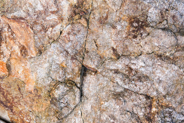 Rock texture and surface background. Cracked and weathered natural stone background.