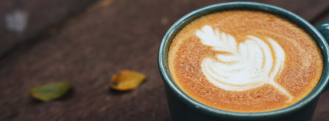 hot latte coffee drink put on wooden table in the morning day