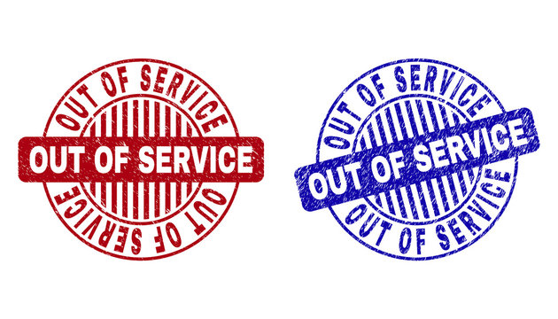 Grunge OUT OF SERVICE round stamp seals isolated on a white background. Round seals with grunge texture in red and blue colors.