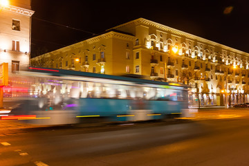 The motion blurred tram in the evening.