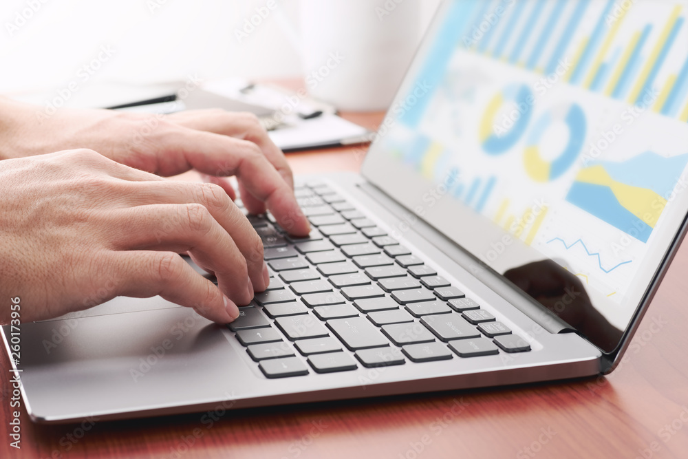 Fototapete Business intelligence concept. Buinessman using laptop for business research and analysis. Analytics dashboard with many graphs and charts.