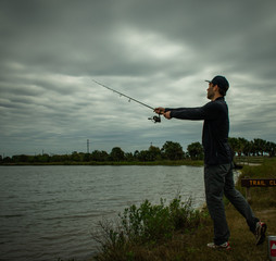 Fisherman In Action Standing Up Casting