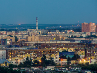 old town with a factory pipe in the distance