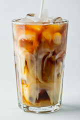 glass of cold coffee on white background.