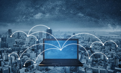 Computer notebook with network connection in the city. Internet networking and connection