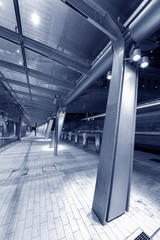 Modern pedestrian walkway in midtown of Hong Kong city at night