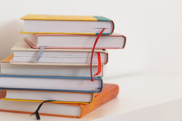 Many books on library table.