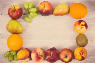 Frame of fresh natural fruits containing nutritious vitamins for healthy lifestyles, place for text or inscription