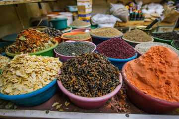 Colorful spices powders and herbs in traditional street shop in Aqaba. Jordan.