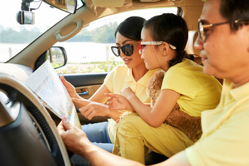 Family examining map