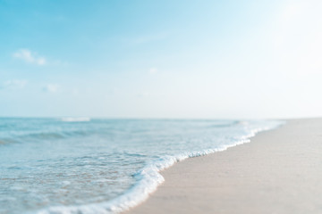 Tropical beach on blue sky abstract background.