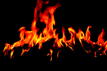 Flame burning at night on a colored background