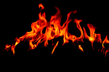 Flame burning at night on a colored background