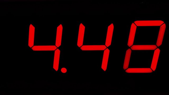 red stopwatch digital timer counting to fifteen