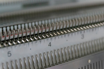 Manual knitting machine. A knitting machine is a device used to create knitted fabrics